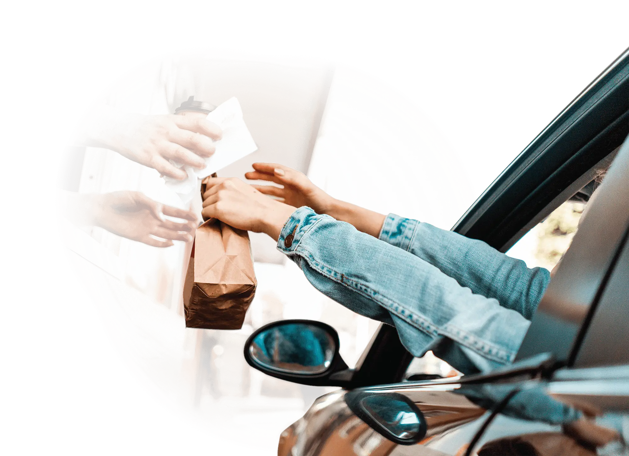 A woman shopping, while holding her phone and jar of pickle 